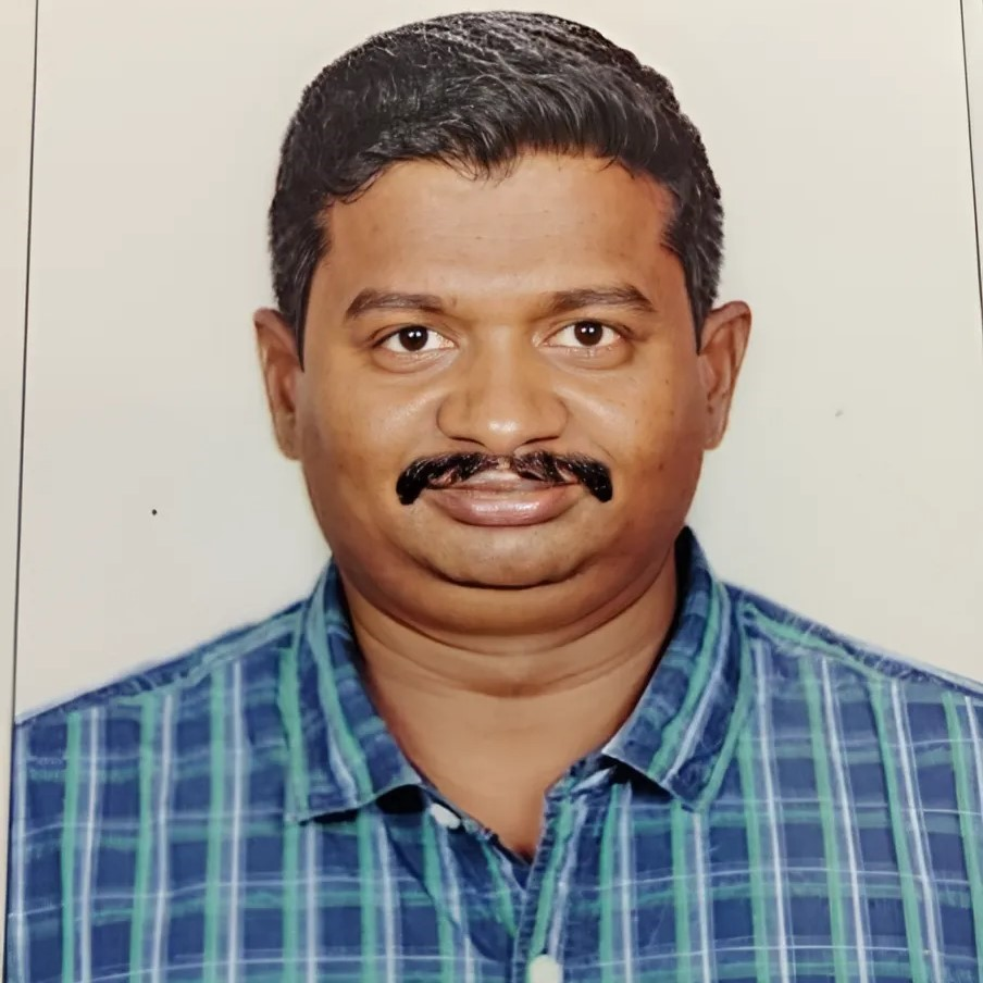 Friendly staff helping an elderly woman at Tamilnadu Old Age Home